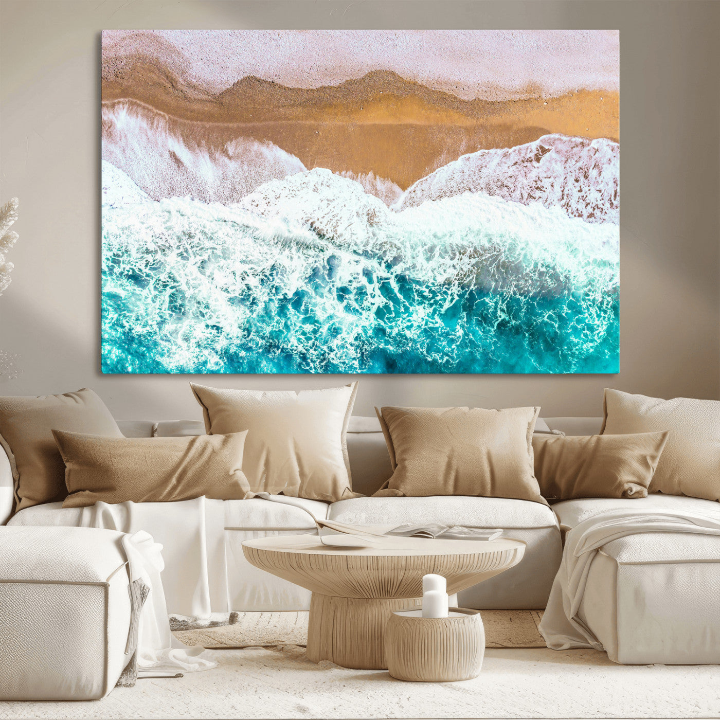 Aerial view of ocean waves crashing onto a sandy beach, with turquoise water and foamy white surf, creating a serene coastal aesthetic for home decor.