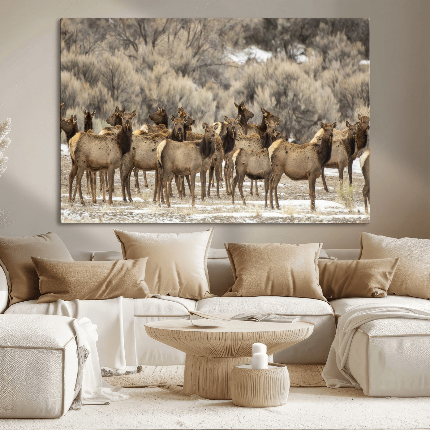 A stunning wall art canvas print featuring a large herd of elk standing together in a natural winter landscape with muted earthy tones and soft background foliage, perfect for rustic or nature-inspired home decor.