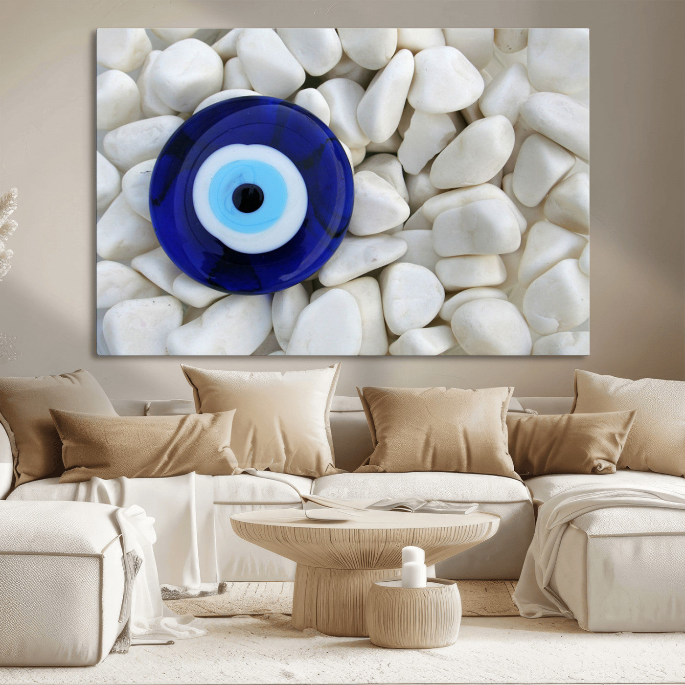 A close-up of a blue evil eye charm placed on white pebbles, symbolizing protection and good luck.