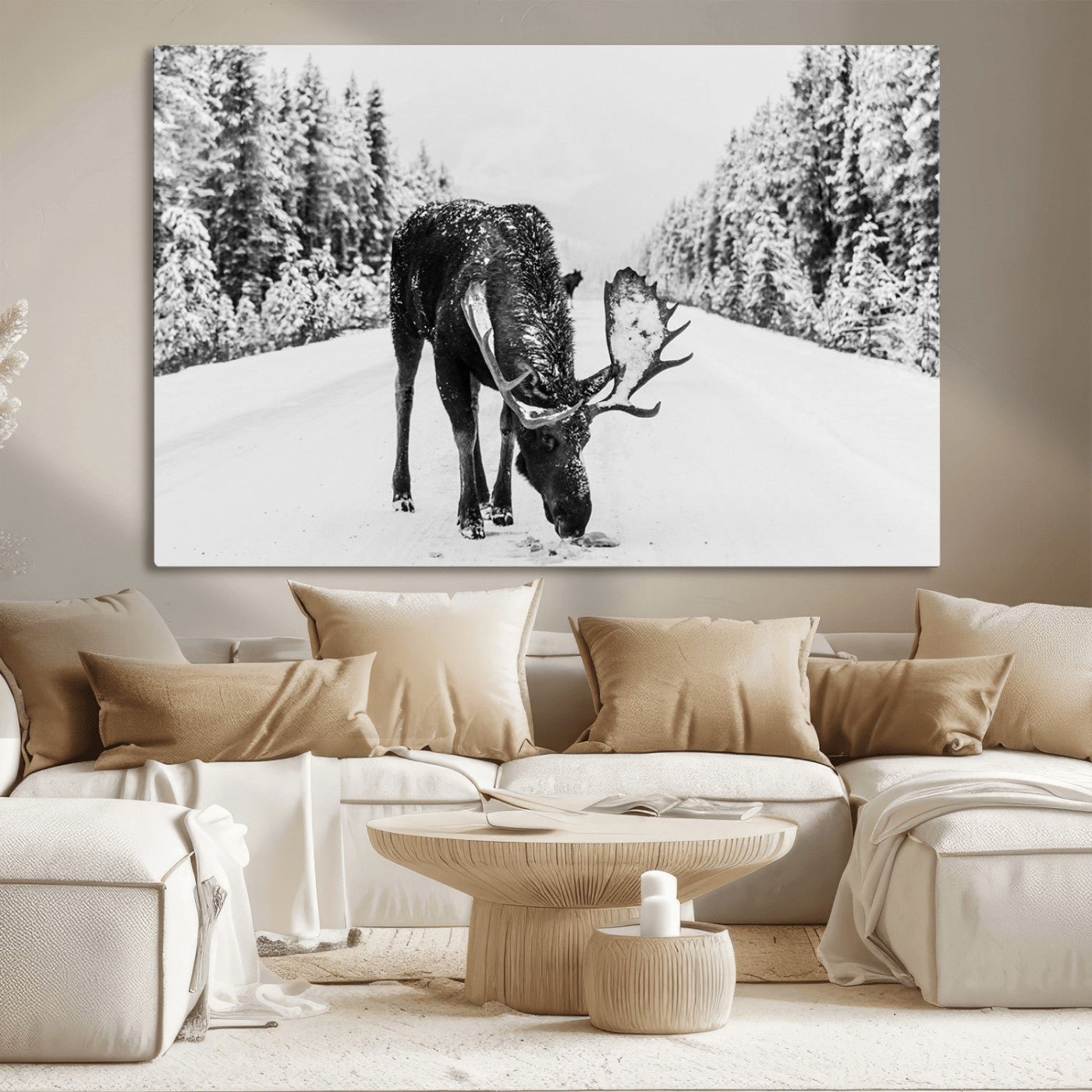 A majestic moose grazing in the snow-covered wilderness, surrounded by snow-covered trees, creating a peaceful winter scene.