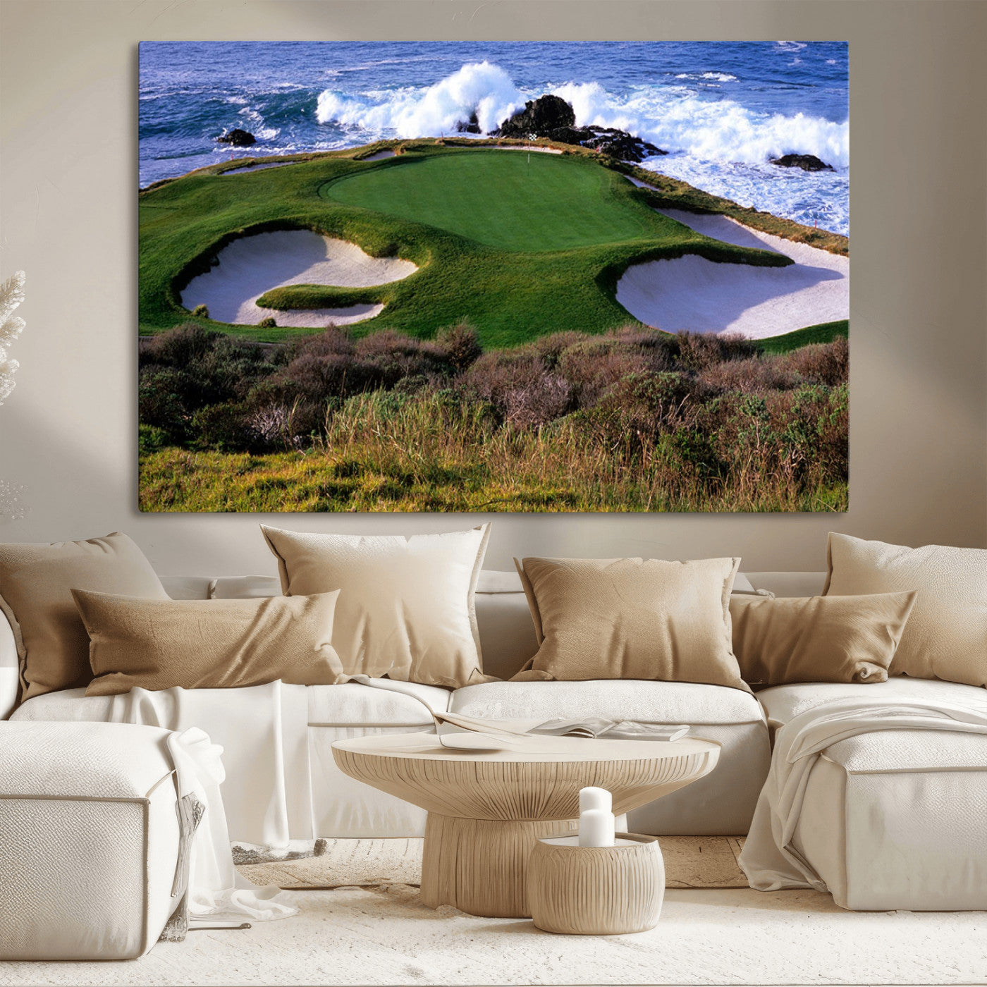 A scenic golf course located by the ocean, featuring a well-manicured green surrounded by sand traps and powerful ocean waves crashing on the shore.