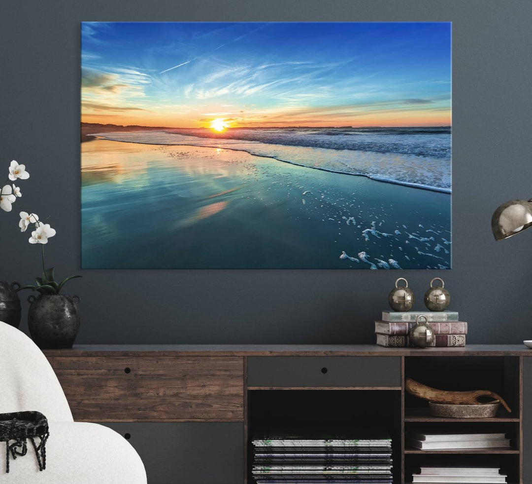 The Blue Sky and Beach Wall Art Canvas Print features a vibrant orange sky reflecting on wet sand.