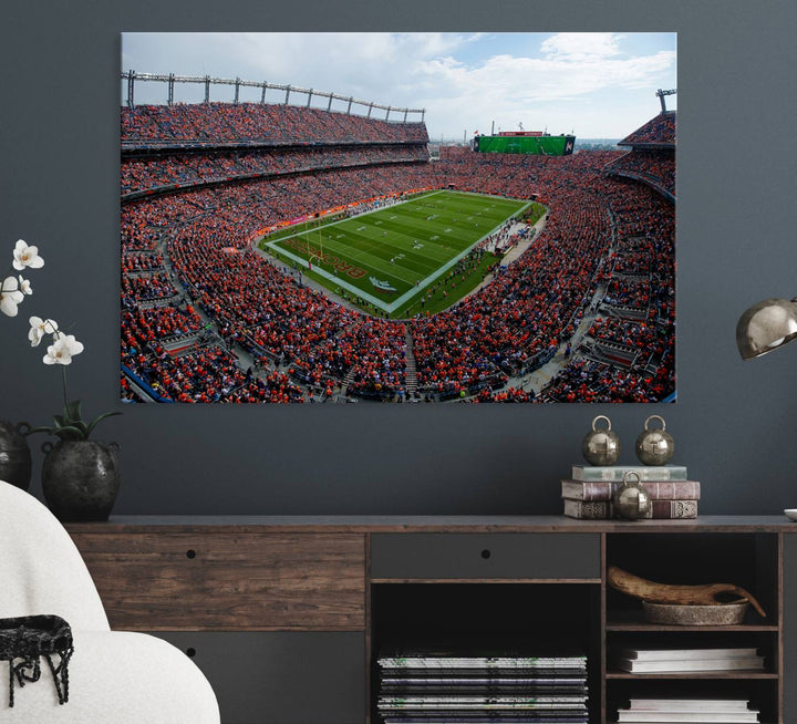 The Denver Broncos Football Print features a vibrant, fan-filled orange stadium overlooking the football field.