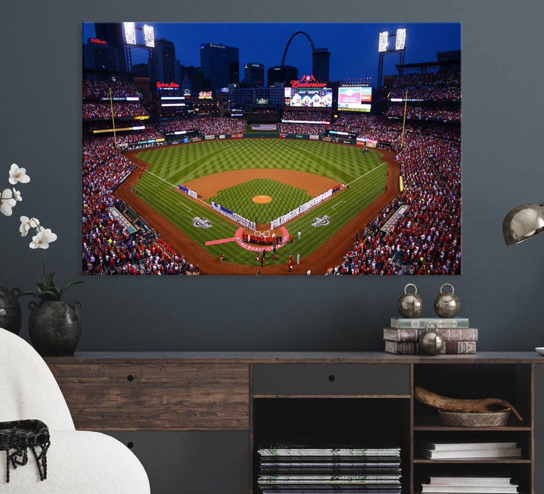 A Cardinals wall art canvas print depicts Busch Stadium with players lined up on the field and a full audience under the lights, capturing the vibrant atmosphere.