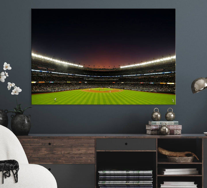 A night game at Yankee Stadium depicted on canvas beneath a sunset sky.