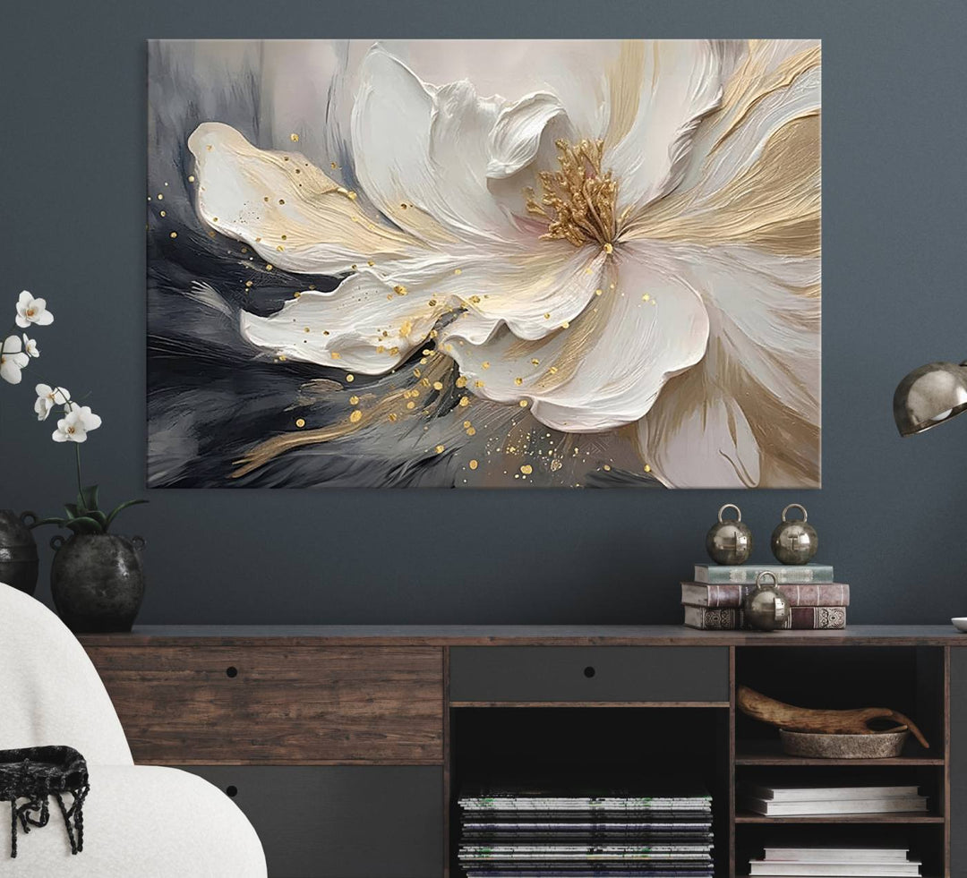 Elegant White and Gold Floral Triptych Canvas Art, a modern textured flower painting for home or office decor, features a blurred gray background.