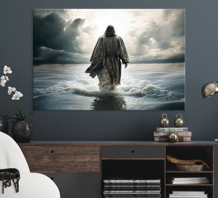 A canvas wall art depicting a figure walking on water beneath dramatic clouds, designed as inspirational religious imagery and ready to hang.