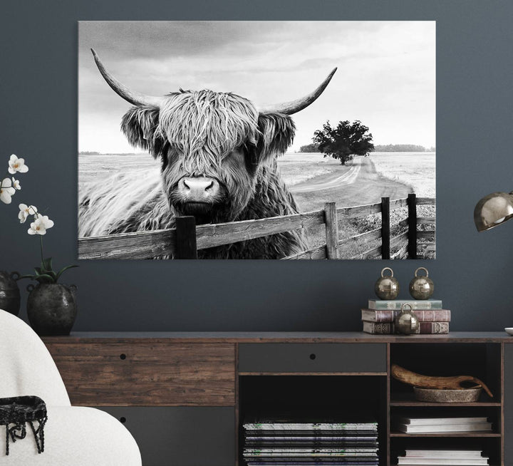 The Scottish Highland Cow Wall Art, a black and white canvas print, enhances rustic farmhouse décor.