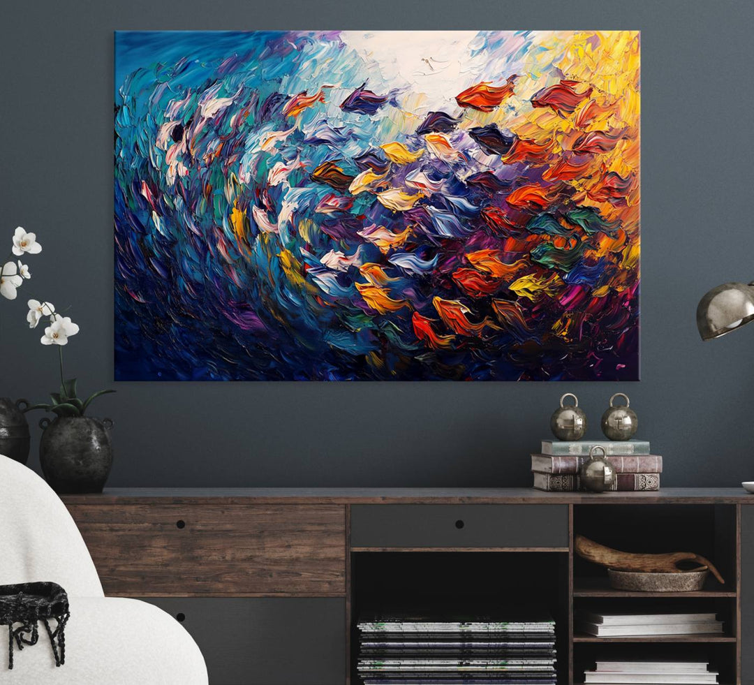 The Vibrant Abstract Fish Swarm Art features a colorful 3-piece canvas that adds a pop of color.