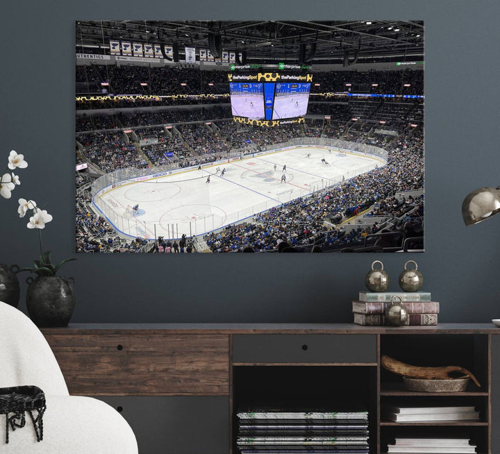 A large Enterprise Center canvas of a crowded hockey arena hangs prominently.