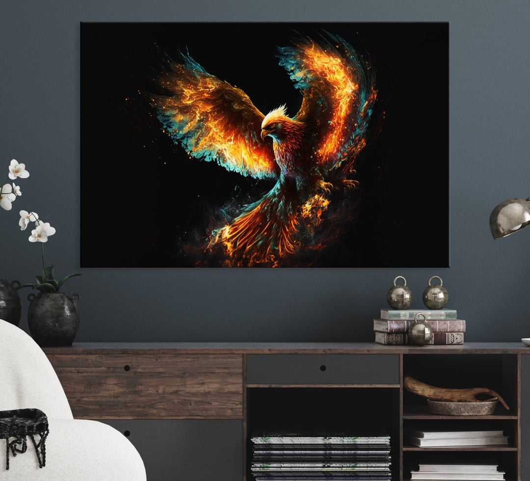 The Fiery Phoenix Canvas Print, showcasing a majestic bird with fiery wings against a black background, makes for the perfect bold decor in your living room.