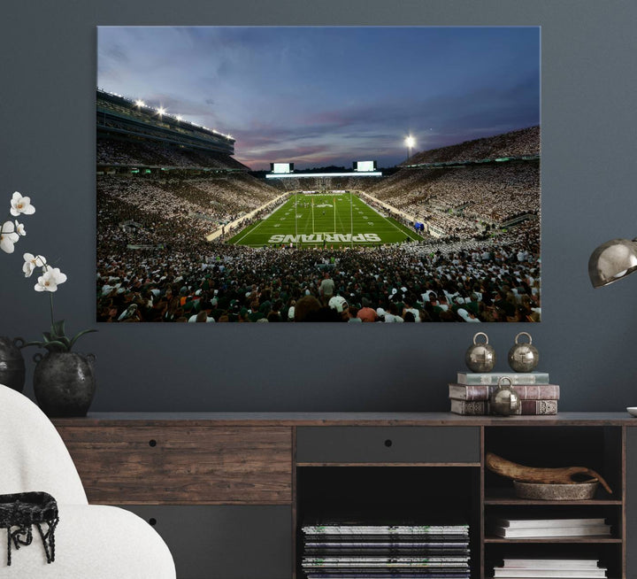 Wall art featuring a stadium at dusk with full stands—ideal for the Michigan State Spartans Football Team Canvas Print.