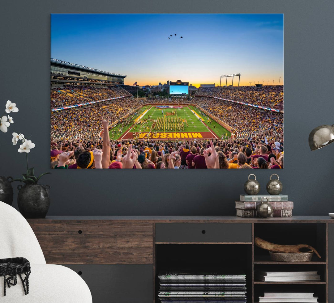 Canvas wall art featuring the University of Minnesota Football Team print, showcasing Huntington Bank Stadium at sunset with jets overhead.