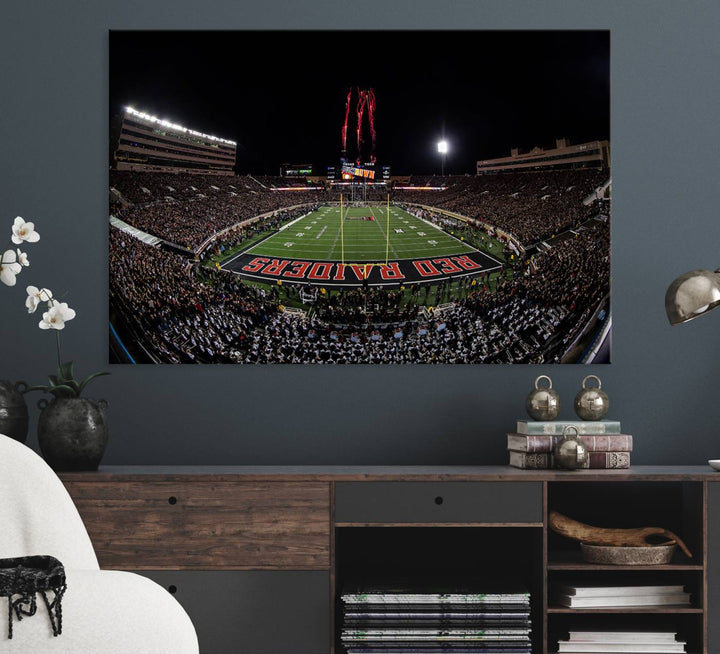 The wall features a Texas Tech Red Raiders Football Team Print on canvas, showcasing fireworks over a packed stadium at night.