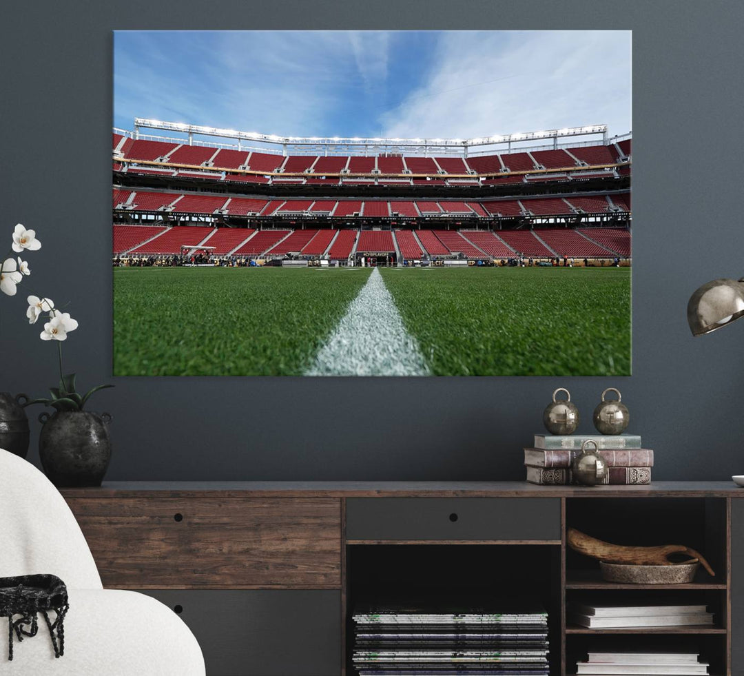 A canvas print of the University of Tulsa Golden Hurricane showcases H.A. Chapman Stadiums football field and red seats against a backdrop of a blue sky.