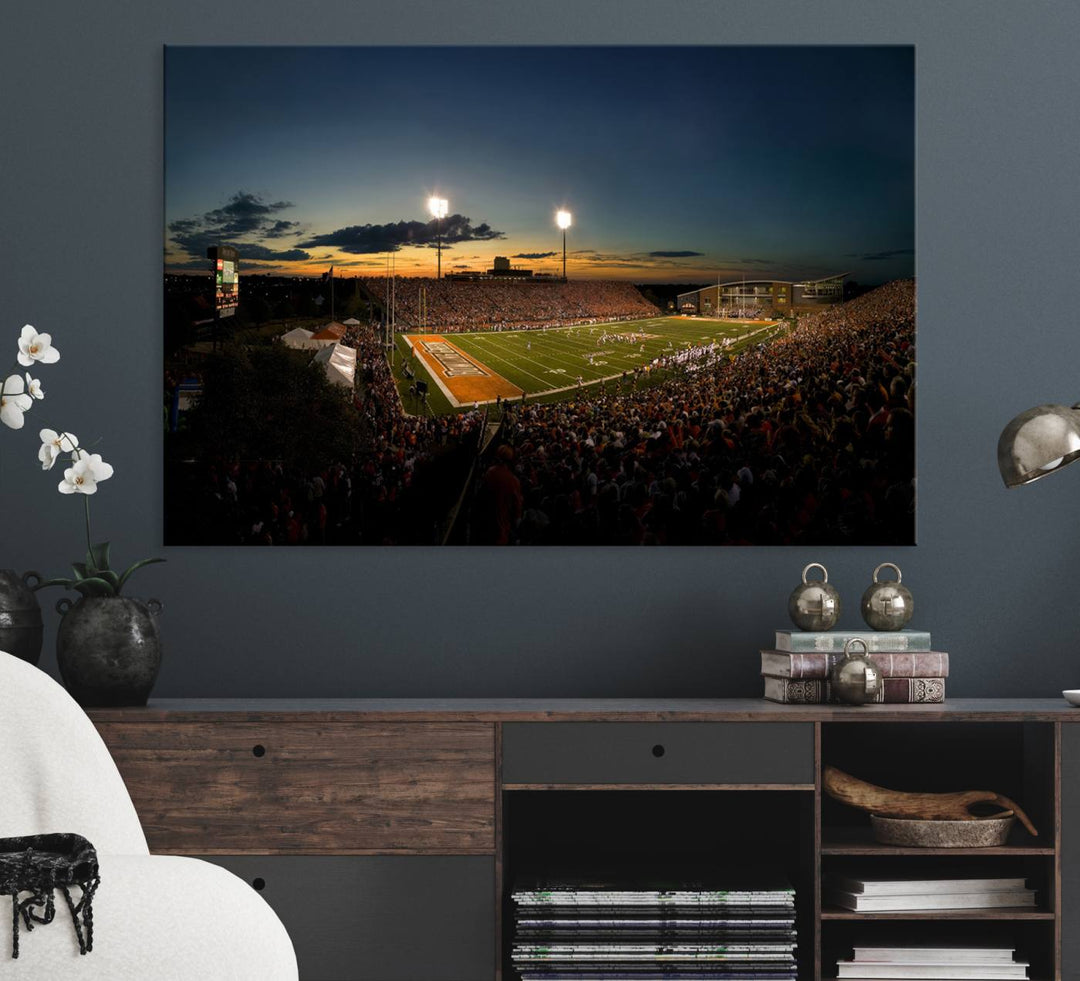 Ball State Cardinals Football Team Print - Muncie Scheumann Stadium Canvas featuring a sunset, floodlights, and lively crowd.