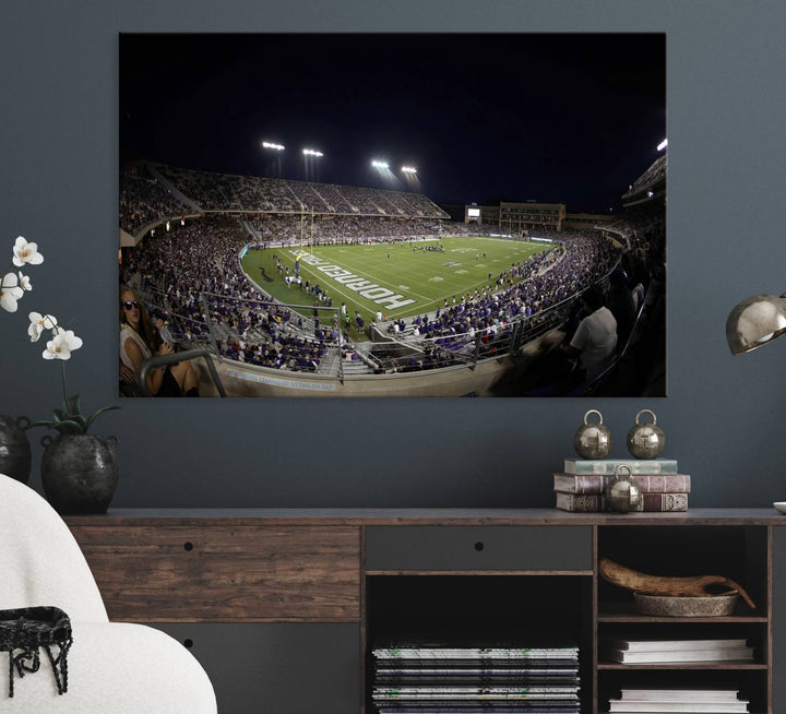 The wall art print features a night view of Amon G. Carter Stadium filled with TCU fans, showcased in the Horned Frogs Football Canvas Wall Art.