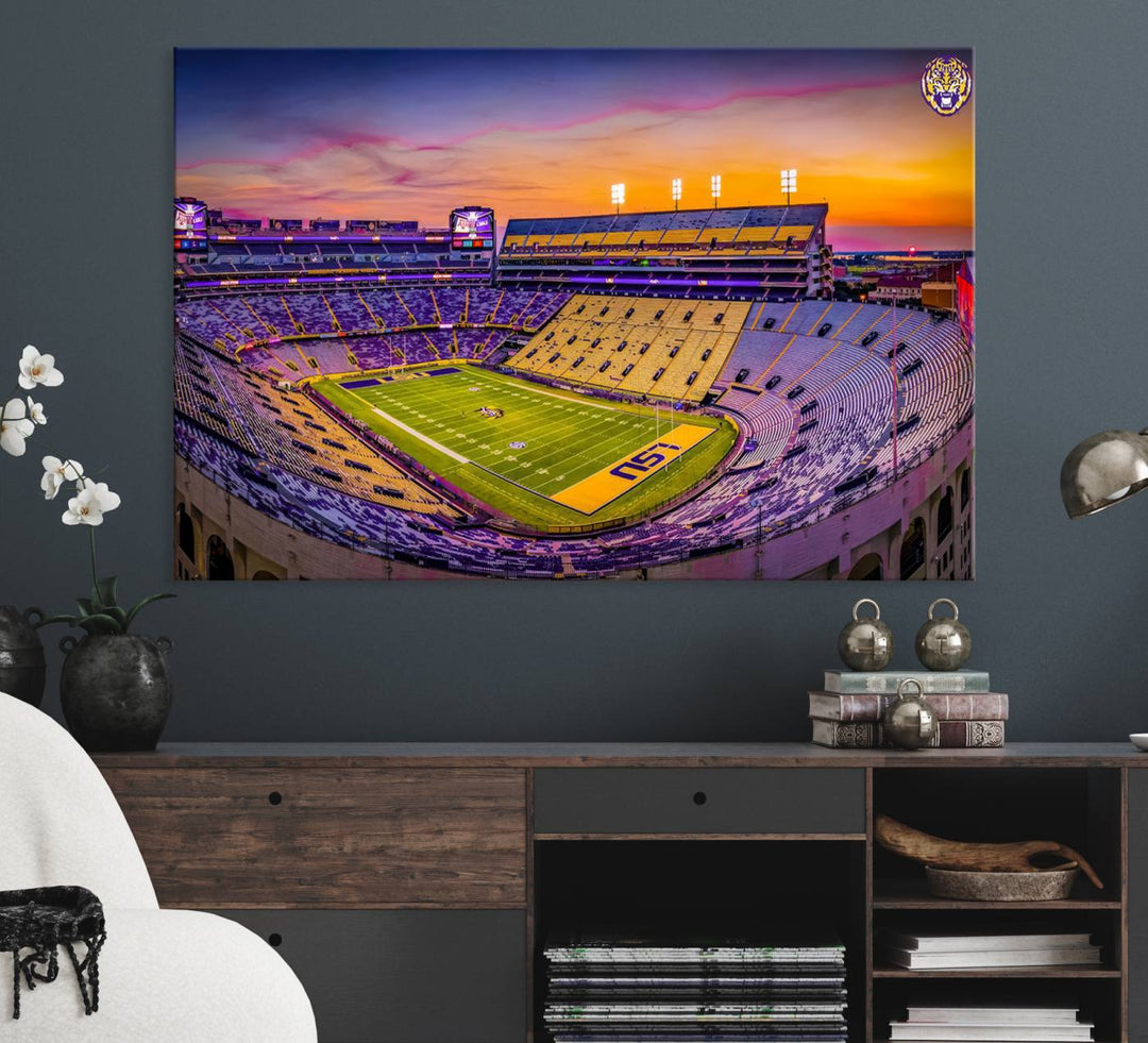 A canvas print of Tiger Stadium at sunset, depicting an empty field and stands, adorns the wall.