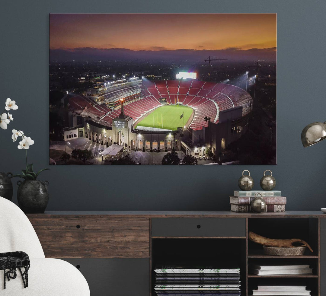 The USC Trojans Stadium canvas captures Memorial Coliseum at twilight, showcasing red seats and a green field beneath an orange sky.