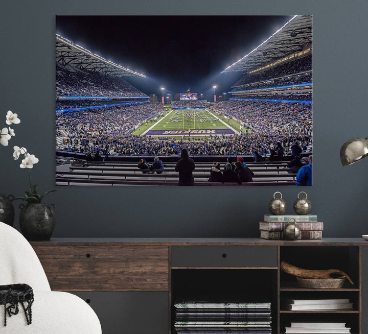 A canvas print titled The University of Washington Huskies Football depicts a packed Husky Stadium at night, as seen from the stands.