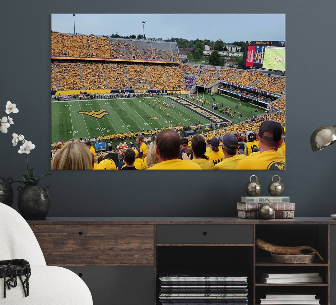 A Puskar Stadium canvas print decorates the modern living room shelf.