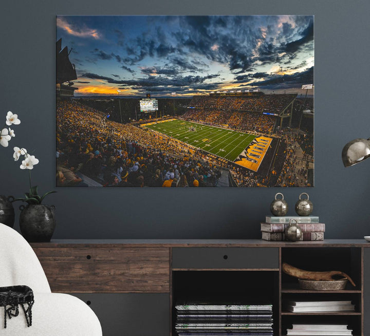 Laramies War Memorial Stadium Print captures a stunning scene of the stadium during sunset, set under a partly cloudy sky illuminated by bright lights.