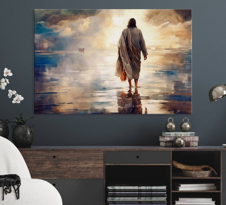 The wall art depicts a robed figure walking on water towards a boat, framed by a stunning sunset. This is showcased in the Jesus Walking on Water Triptych Canvas Print.