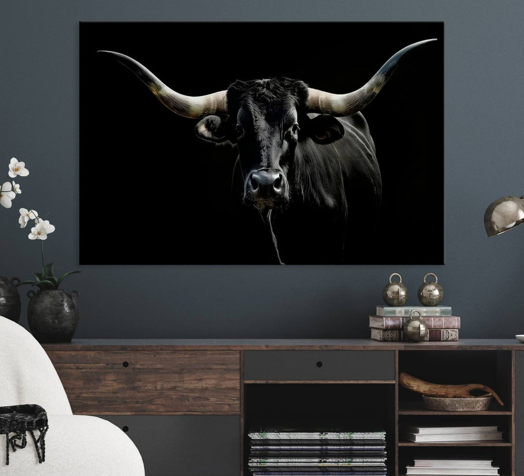 The Texas Black Longhorn Bull Canvas Print, featuring large curved horns set against a dark background, is ideal for Western decor.