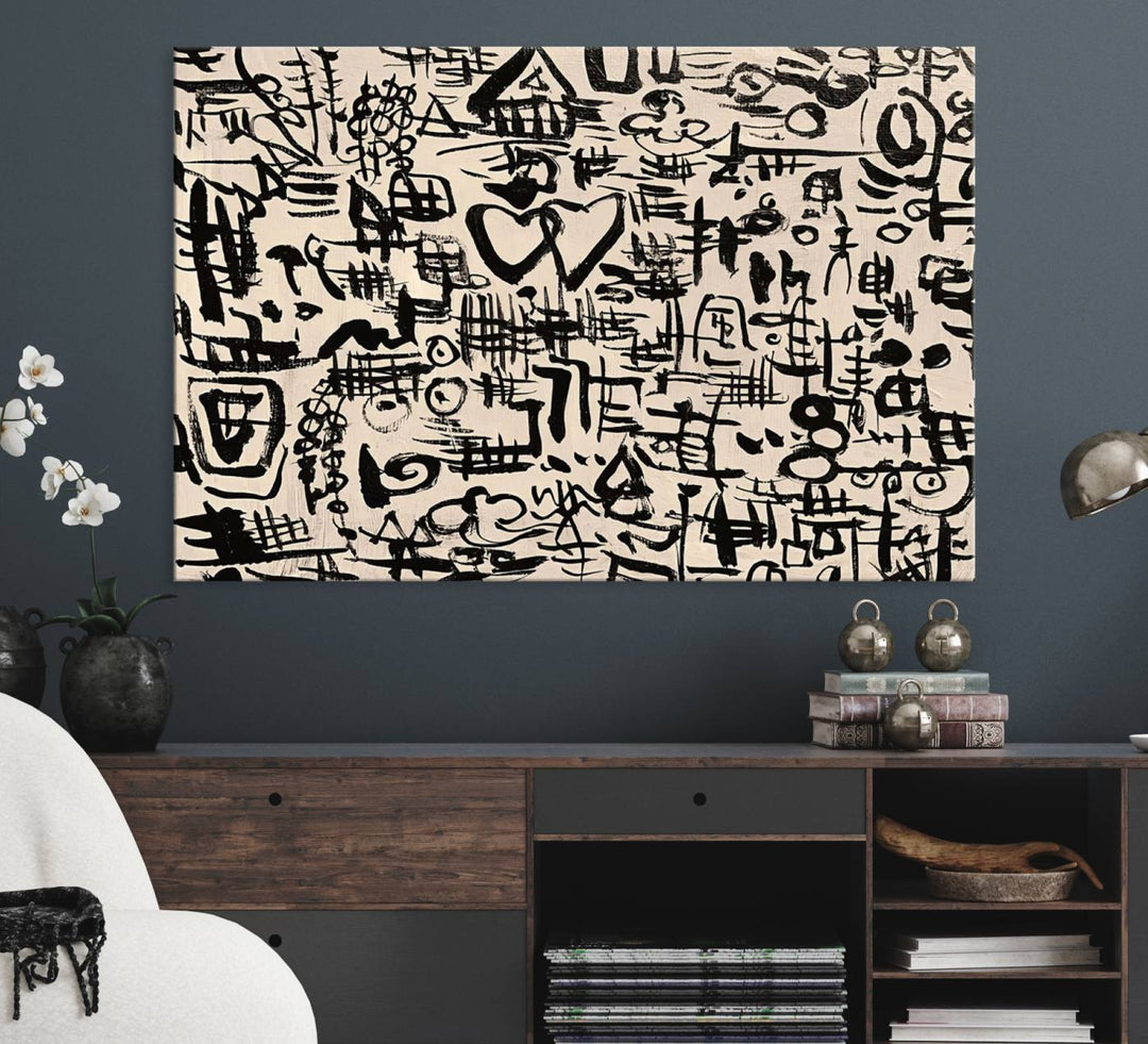 The Abstract Love and Chaos canvas is a museum-quality print featuring black symbols on a beige background, adorned with a heart and scribble design. It is framed to enhance its artistic appeal.