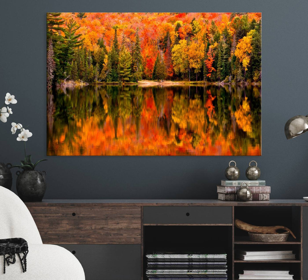 Autumn Forest Reflection Wall Art: a vibrant triptych canvas featuring fall foliage with red, orange, and yellow leaves over a calm lake.