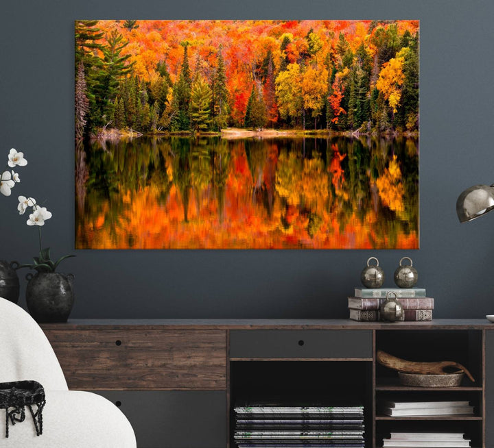 Autumn Forest Reflection Wall Art: a vibrant triptych canvas featuring fall foliage with red, orange, and yellow leaves over a calm lake.