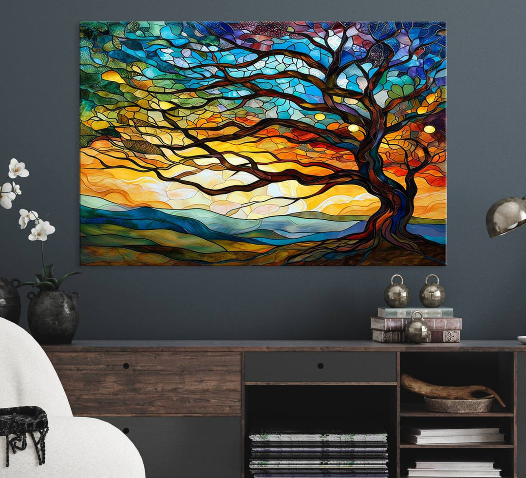 A vivid Tree of Life in stained glass style is depicted with twisted branches, a colorful sky, and hills on a ready-to-hang canvas.