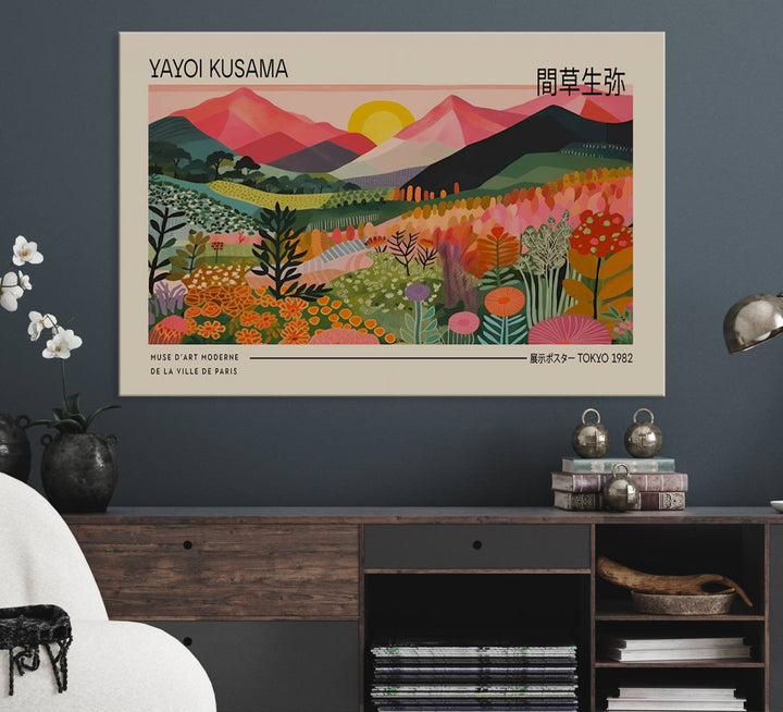 A vibrant abstract triptych features mountains, a sun, and plants in Yayoi Kusamas style with Japanese and French text included.