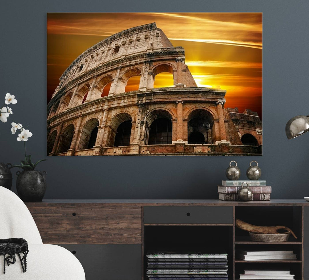 On the wall, theres a piece of art titled Colosseum with Yellow Sunset Behind, Italy.