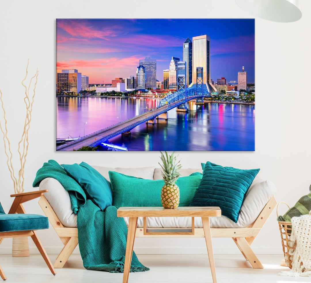 The Jacksonville Wall Art Canvas Print, showcasing the Jacksonville cityscape over a river at sunset, is elegantly crafted on museum-quality canvas with a UV-protective coating. Ready to hang, it elevates your space with its sophisticated charm.