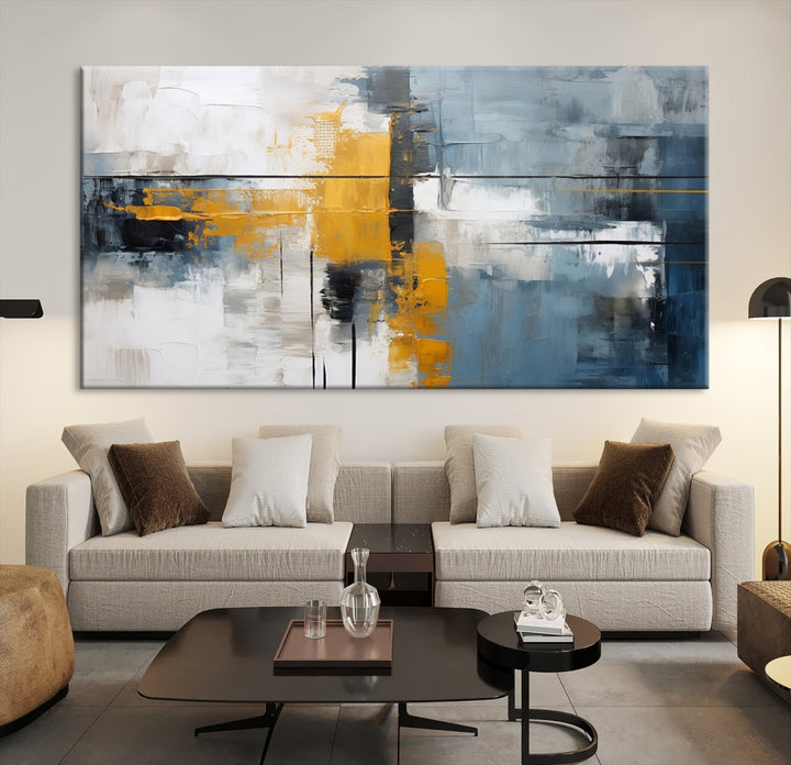 The Orange Abstract Wall Art Print features a series of white, blue, black, and yellow blocks arranged in a triptych format on museum-quality canvases. Proudly made in the USA and offered with free shipping.