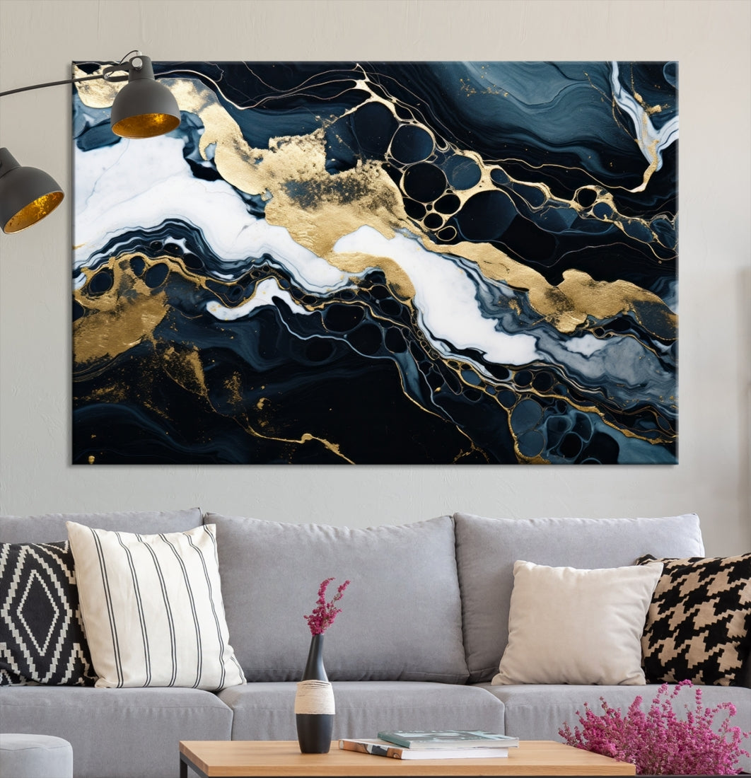 Fluid Marble Abstract Wall Art Print, a contemporary piece with black, white, and gold swirls on museum-quality canvas.