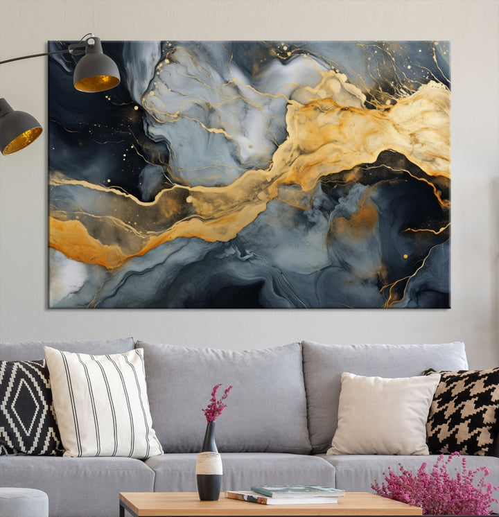 The living room features the Golden Gray Abstract Wall Art Print Contemporary Art Canvas Design, a triptych showcasing gold, black, and gray swirls. Crafted on museum-quality canvas and ready to hang, this piece is designed for elegance and durability.