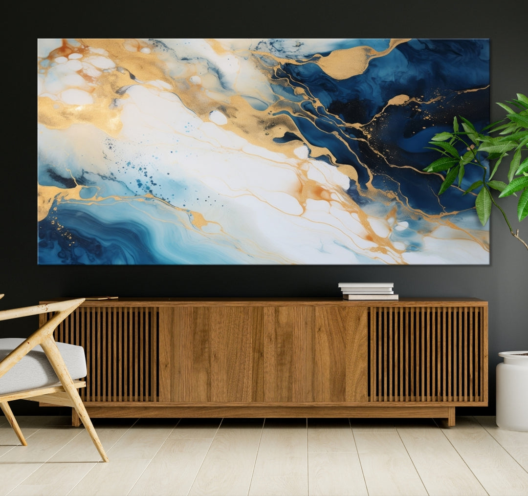 A modern living room featuring museum-quality Blue Gold Abstract Wall Art Print Contemporary art in a triptych arrangement.