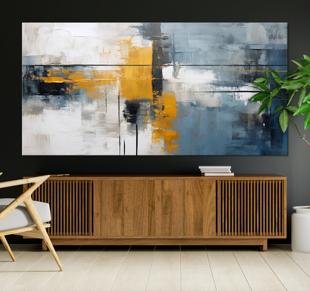 The Orange Abstract Wall Art Print features a series of white, blue, black, and yellow blocks arranged in a triptych format on museum-quality canvases. Proudly made in the USA and offered with free shipping.