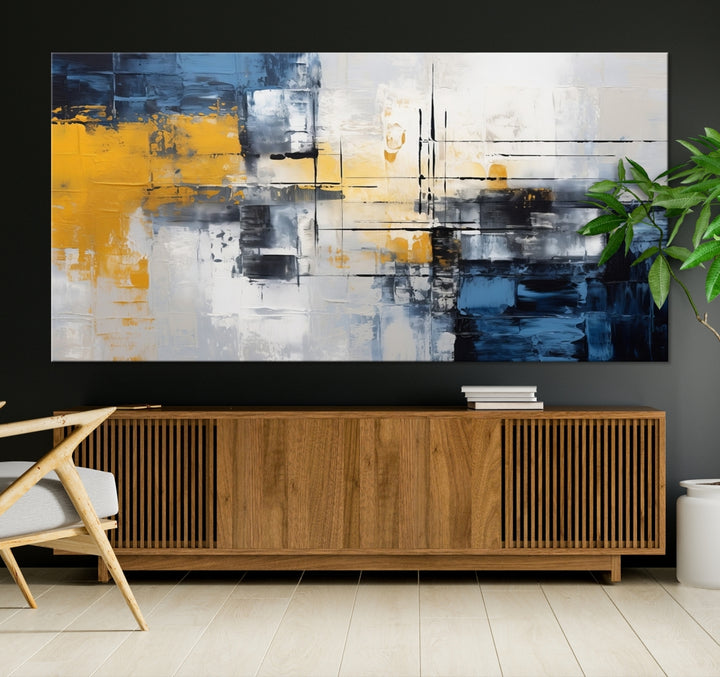 The Yellow Orange Blue Abstract Wall Art Print on gallery-wrapped, museum-quality canvases adds a vibrant touch to the room.