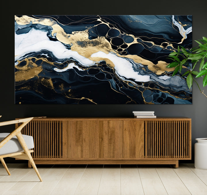 Fluid Marble Abstract Wall Art Print, a contemporary piece with black, white, and gold swirls on museum-quality canvas.