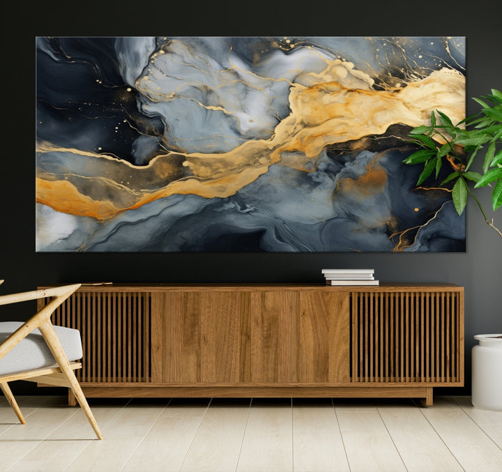 The living room features the Golden Gray Abstract Wall Art Print Contemporary Art Canvas Design, a triptych showcasing gold, black, and gray swirls. Crafted on museum-quality canvas and ready to hang, this piece is designed for elegance and durability.