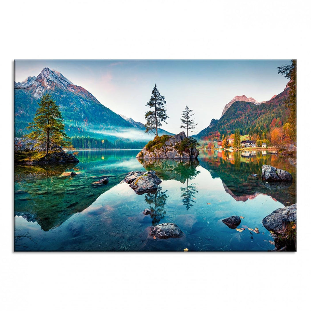 The 3-panel wall art showcases a serene mountain lake with rocky islands and trees, creating an ideal focal point for dining rooms or offices.