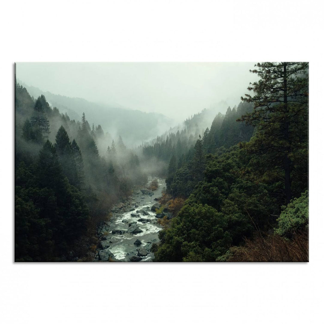 The Misty Forest Wall Art features a serene landscape with a misty river and evergreens, ideal for enhancing the ambiance of any living room or cabin.