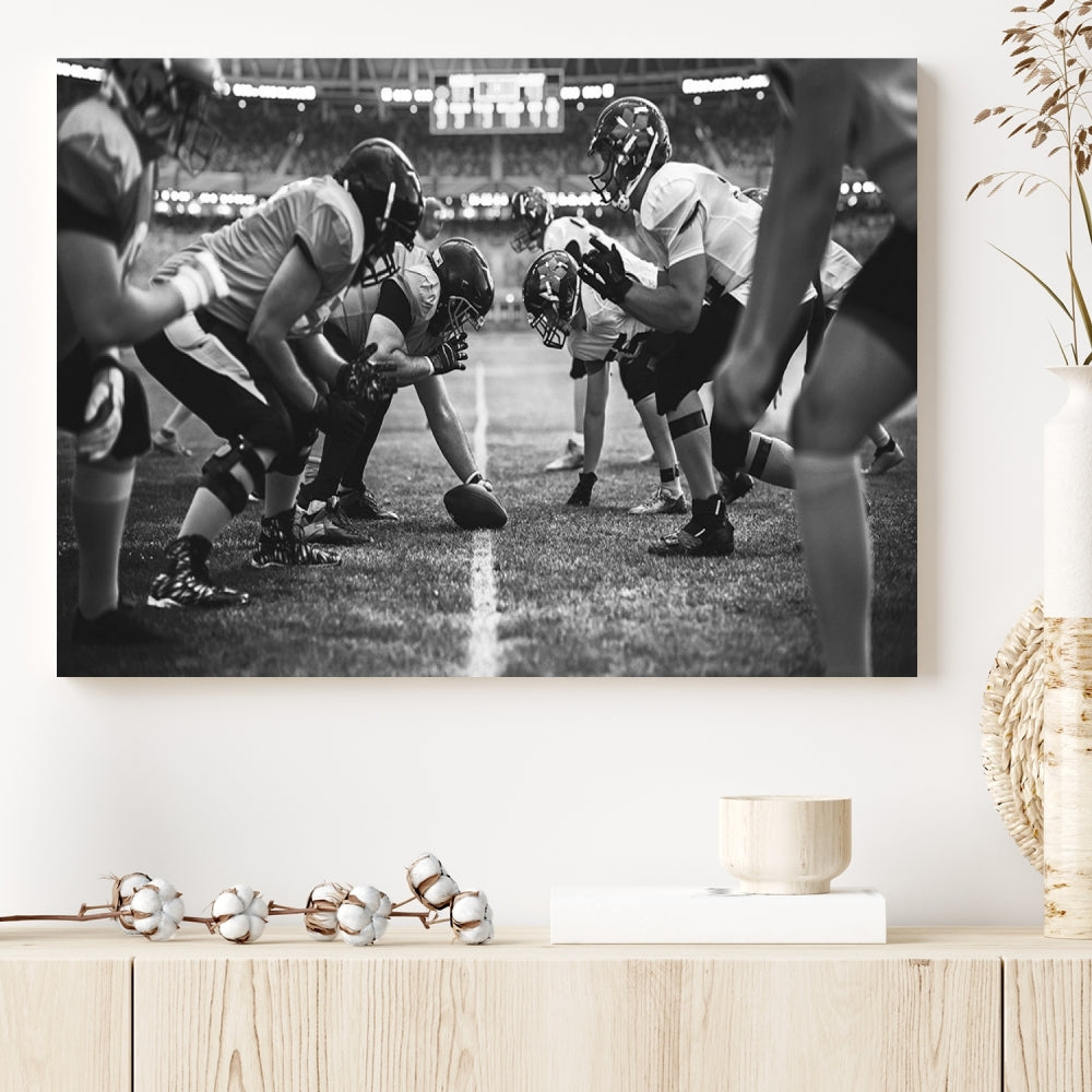 The "American Football Match Wall Art Canvas Print," featuring a black and white photo of a football game, is displayed as a triptych. This artwork is printed on museum-quality canvases and protected with a UV-coating.