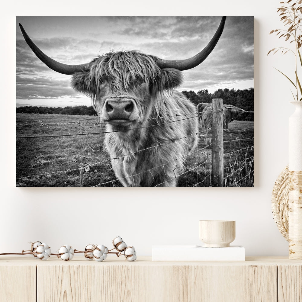 The "Scottish Highland Cow Canvas Wall Art Farmhouse Decor" adds a touch of rustic charm to your living room wall above the couch.