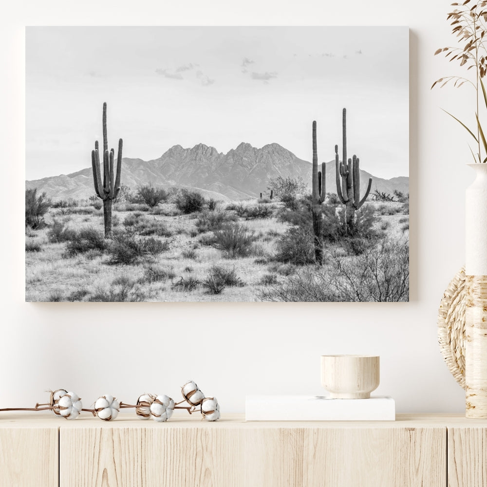 The modern living room showcases the "Black White Arizona Desert Canvas Wall Art Cactus Farmhouse Wall Art," a triptych consisting of gallery-wrapped, museum-quality black-and-white desert landscape photographs featuring cacti.