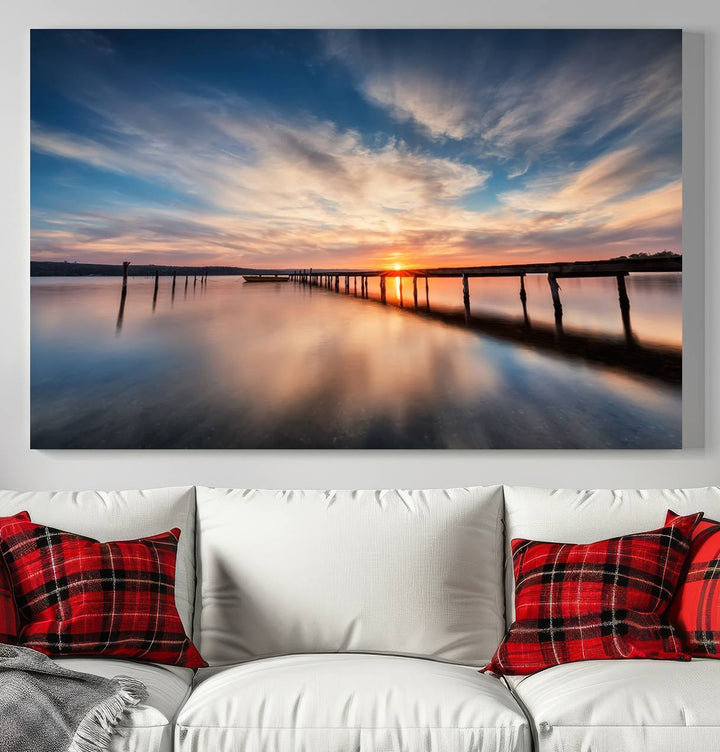 The Sunset Pier Canvas features a serene coastal landscape with vibrant hues under cloudy skies, ideal for modern decor.