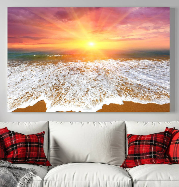 Golden Beach Sunrise 3-panel canvas art of ocean waves, hung on a wooden wall.